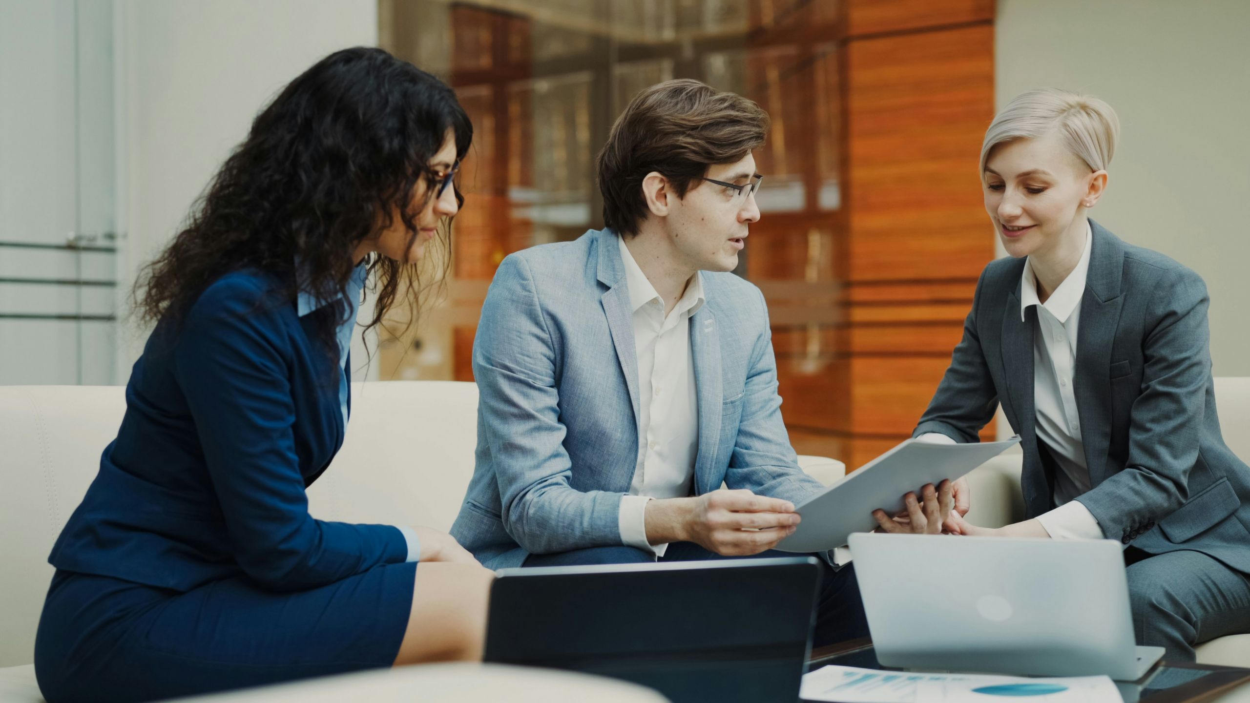 Image representing a recruitment agency with professionals reviewing resumes